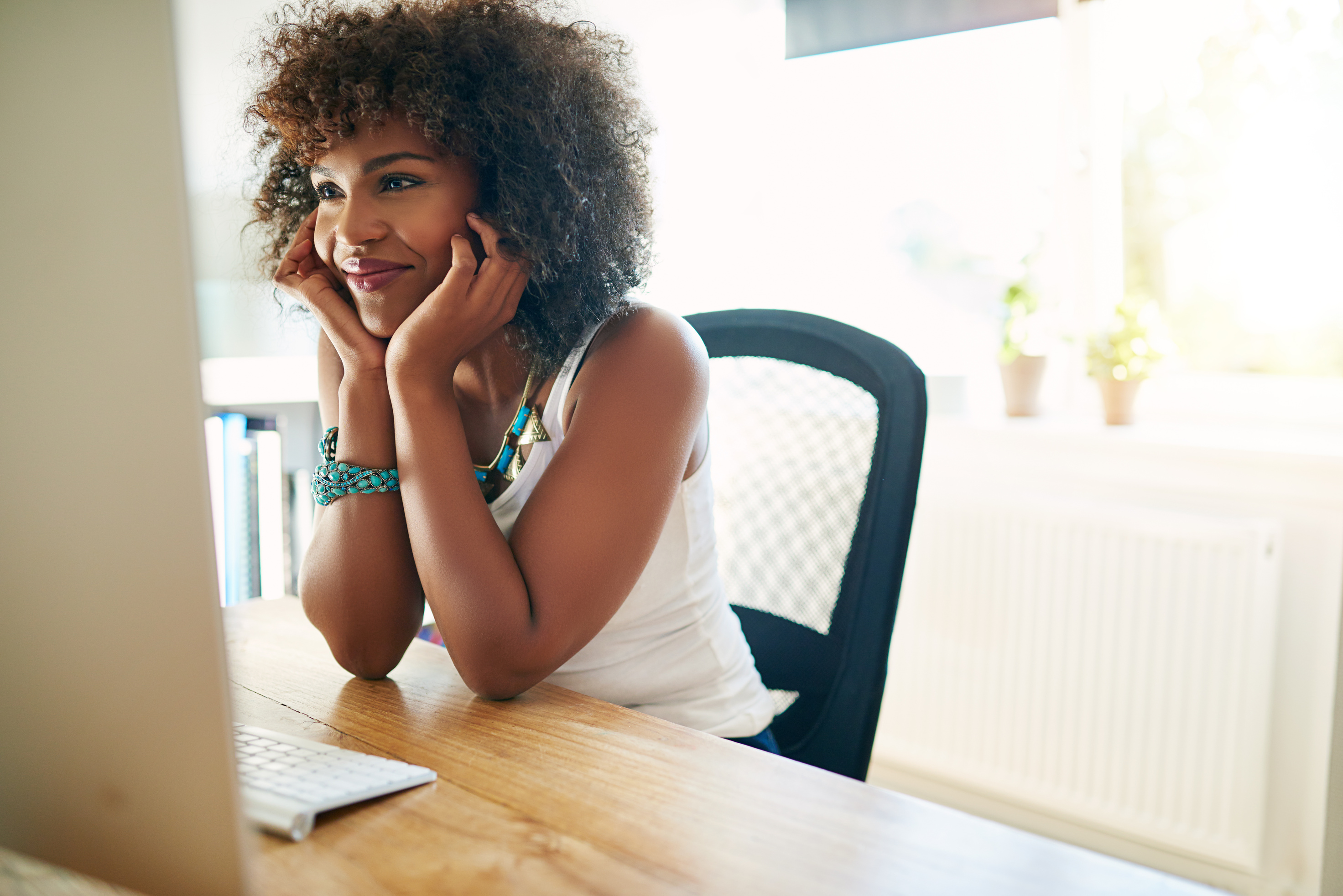 Joyful Girl at Desktop Computer